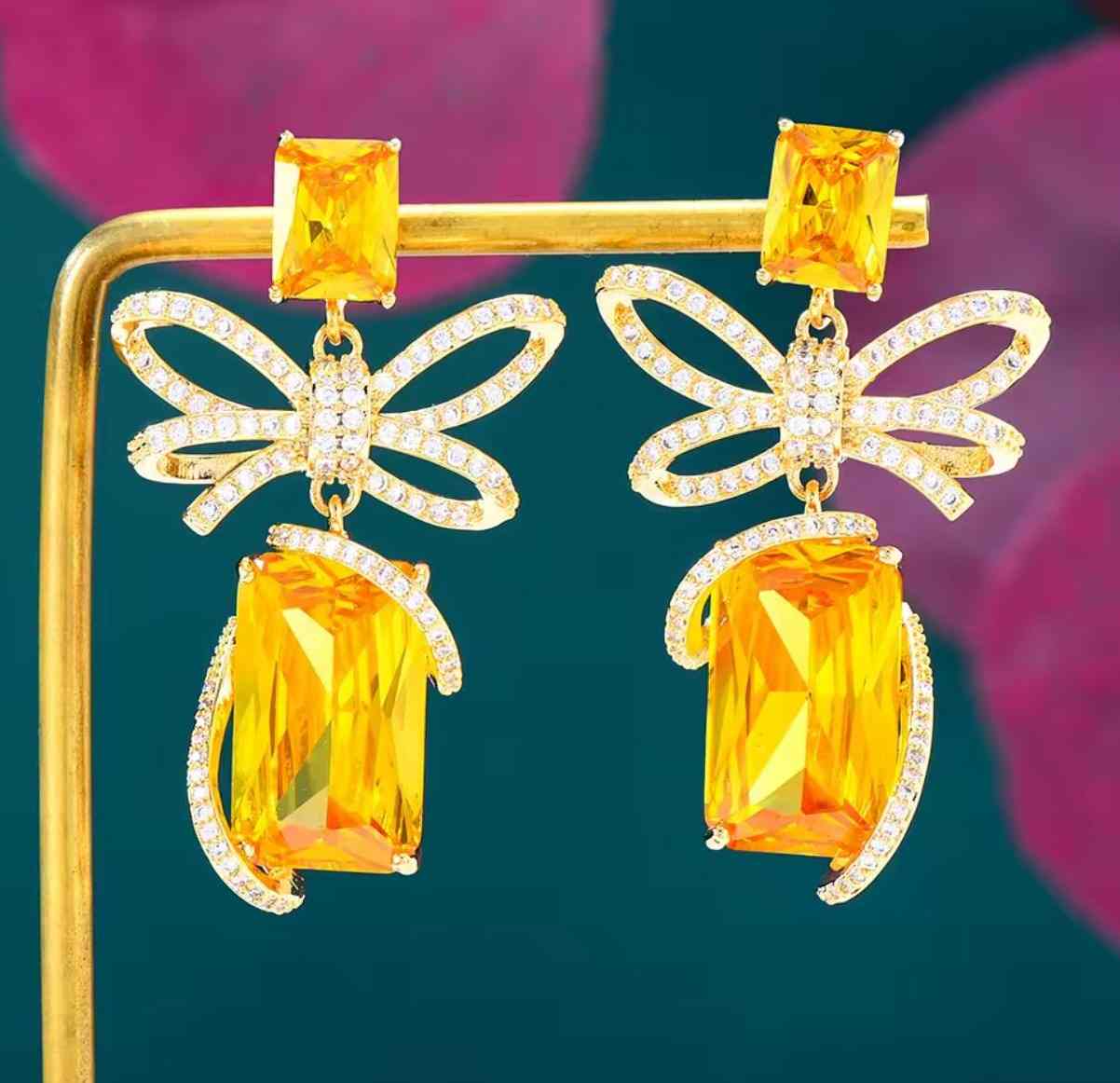 BOW YELLOW SWAROVSKI EARRING image 0